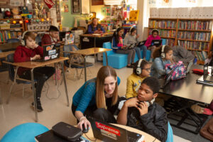 Students at Sutton Middle School compare and contrast songs representing different eras in history during an International Baccalaureate immersion day.